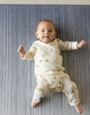 Baby laying on foam mat made for the whole family the navy play mat Kasuri by totter and tumble is perfect for stylish homes
