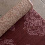 Close up of the Merah and Rusa playmats featuring a batik inspired design and a textural animal print motif