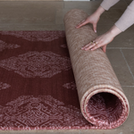 Unrolling one piece memory foam play mat The Merah and The Rusa with the aesthetic of a rug provides protection on tiled and wood flooring