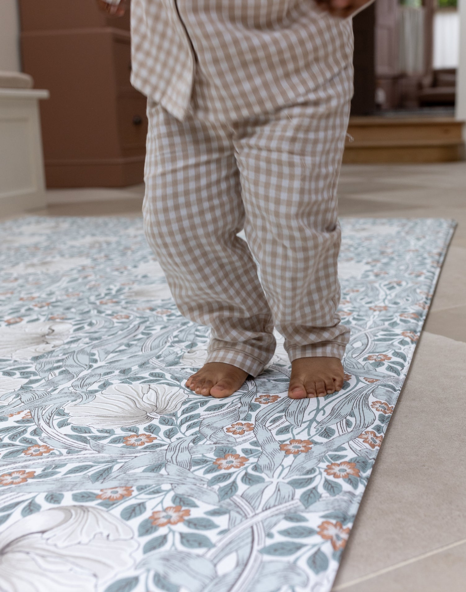 active toddler jumping on soft and cushioned playmat