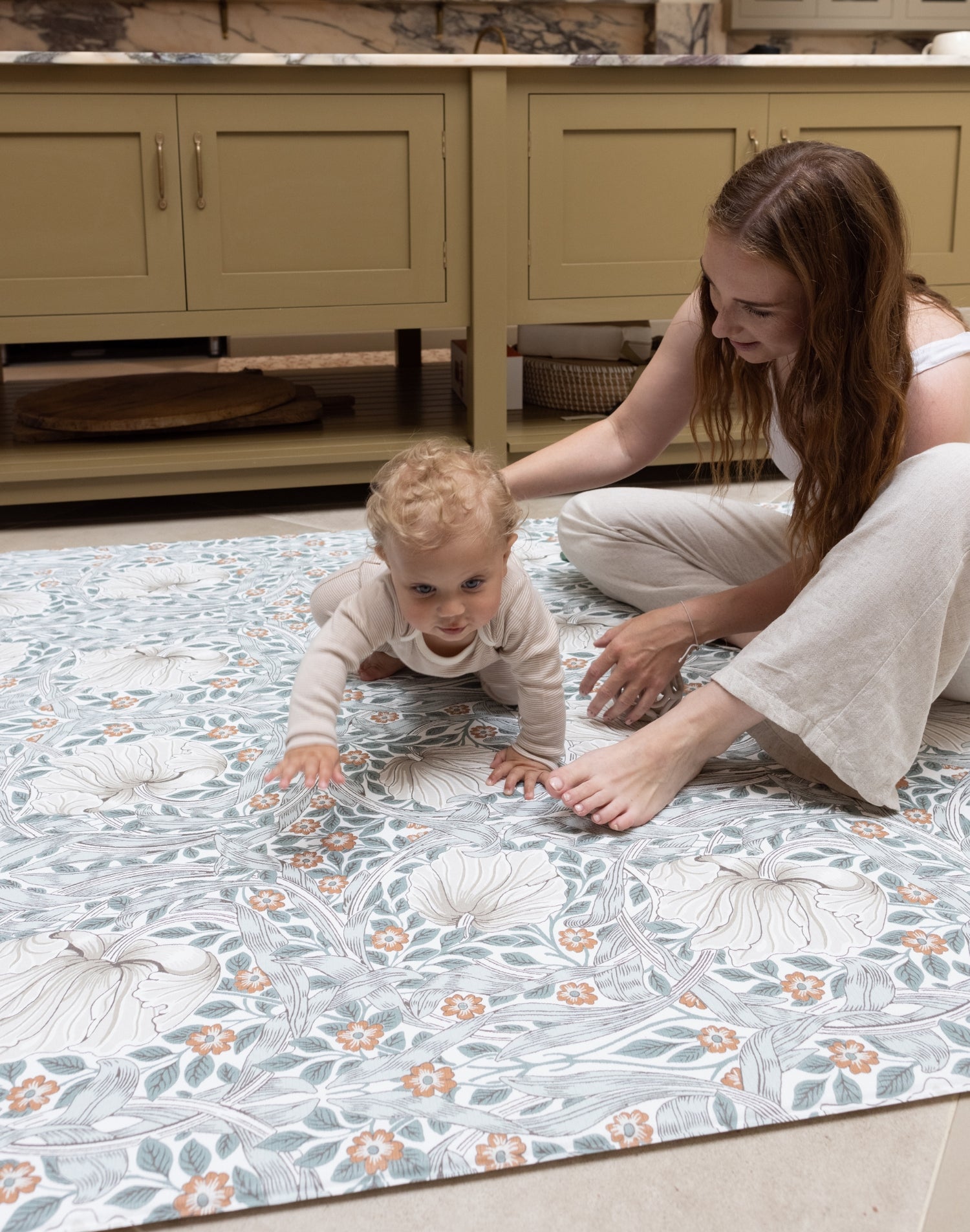 parent and child enjoying kitchen playmat