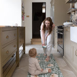 mum and baby on wipeable kitchen runner 