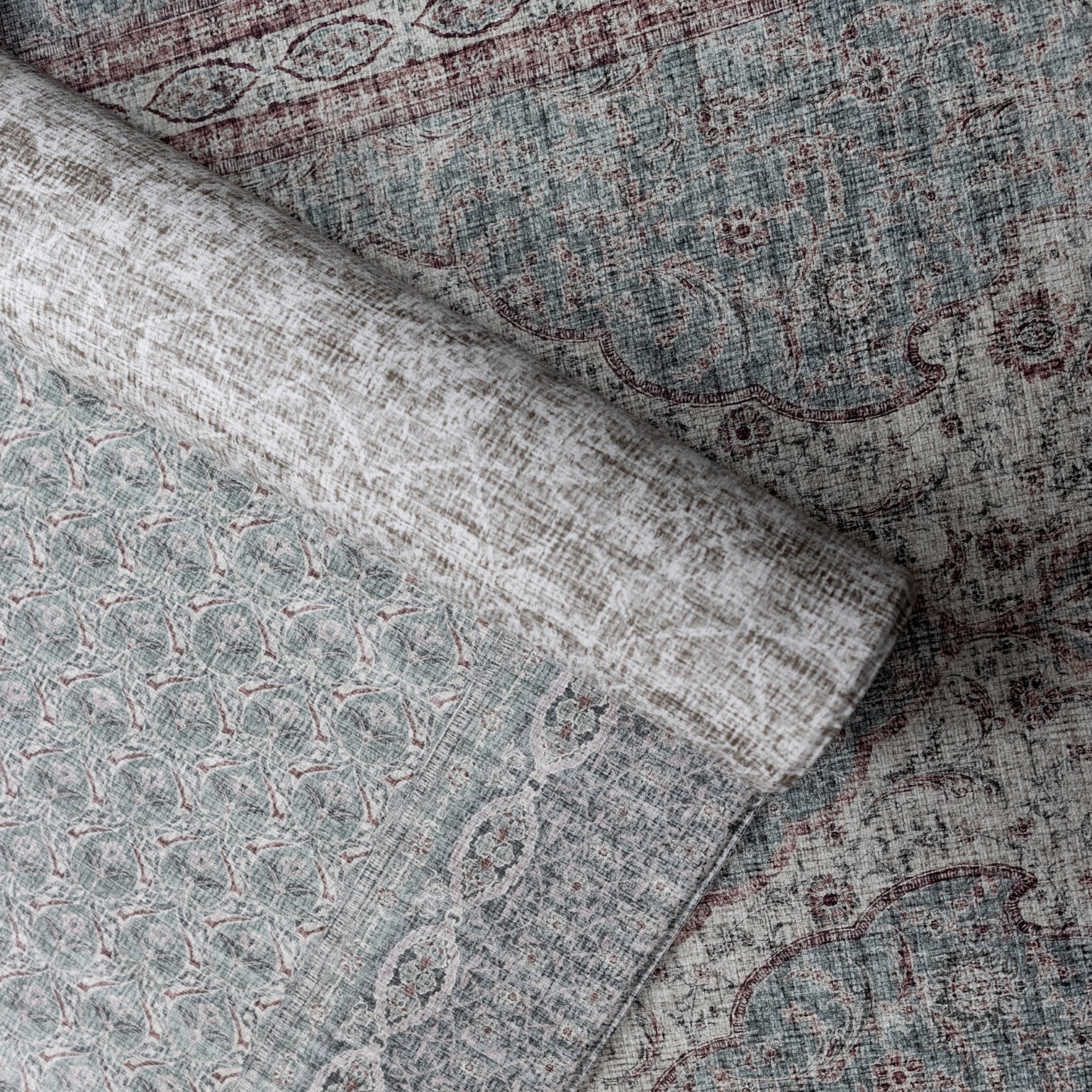 Rolled playmats by Totter + Tumble with texture and a Persian rug style