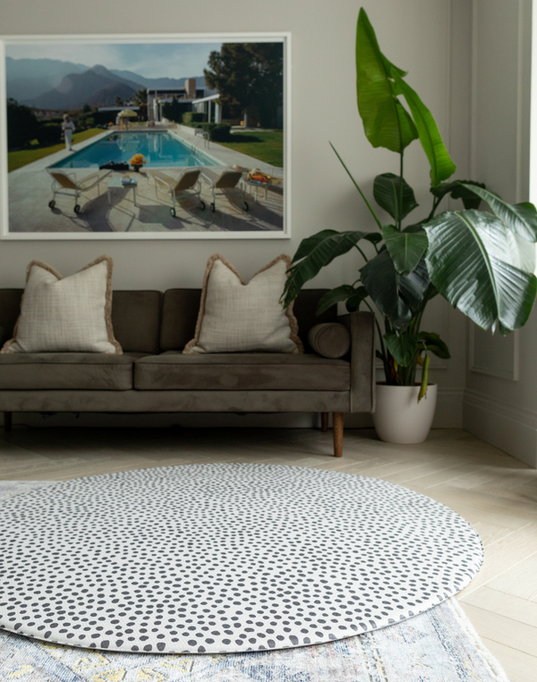 Extra large round kids playmat sits stylishly in a modern family living space 