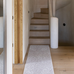 Beautiful grey hallway runner in modern boho home the light grey floor mat is stylish and subtle