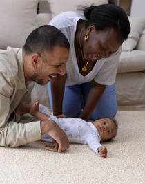 happy family moments on totter and tumble playmat dad mum and baby enjoy playing together on morris & co totter and tumble standen print, one piece, stylish, padded playmats that look like a rug