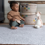 Baby boy plays on leopard print baby playmat designed with thick memory foam 