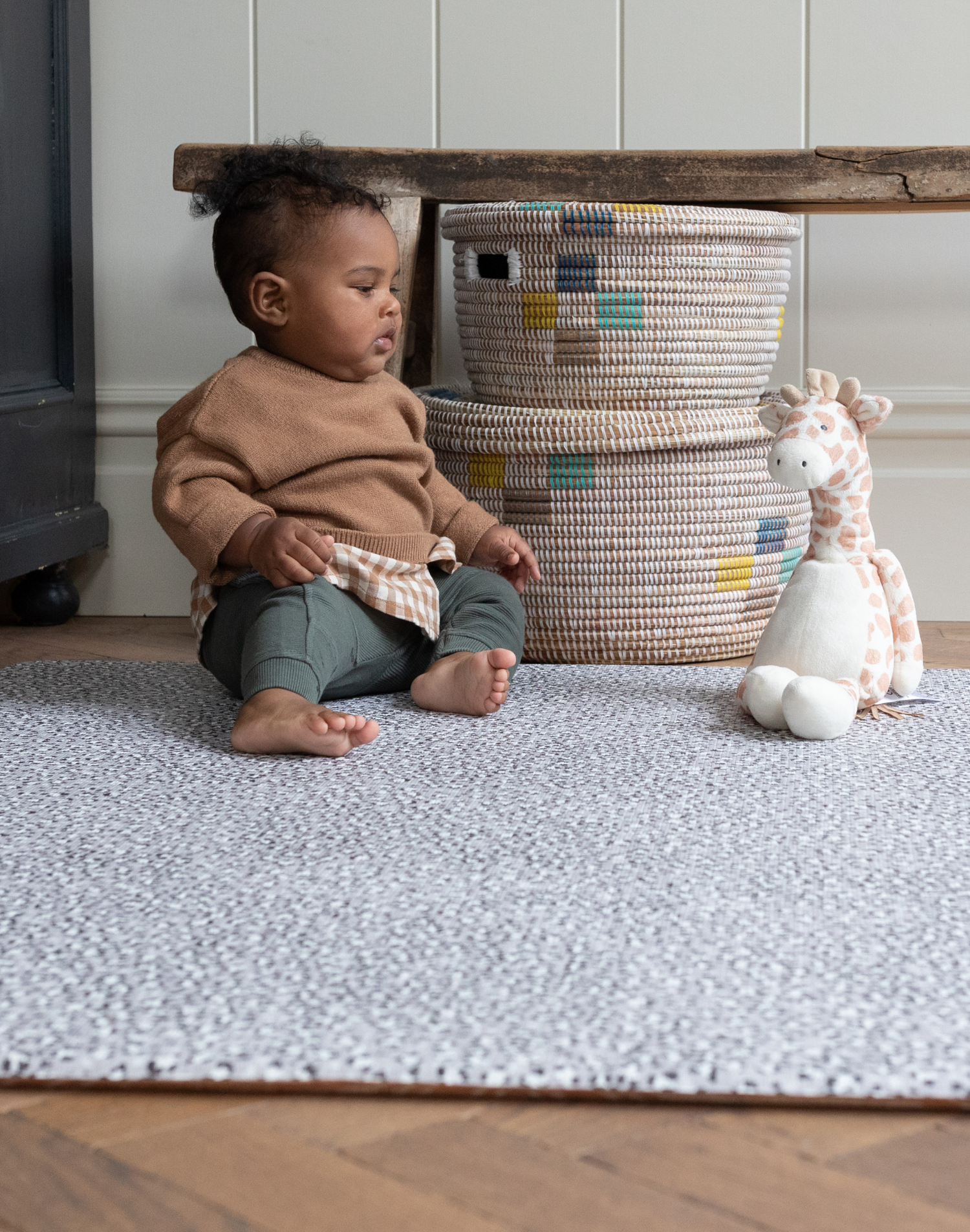 Baby boy plays on leopard print baby playmat designed with thick memory foam 