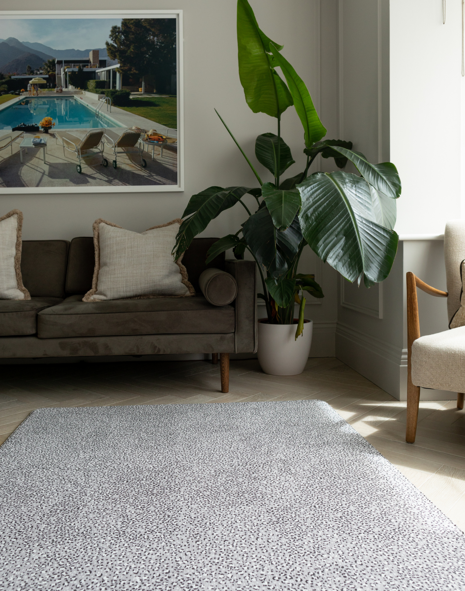 Modern family living room with grey playmat designed to look like a rug 