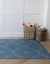 Kilim play rug by Totter and Tumble in a stylish teal shade so your family home can be stylish and practical