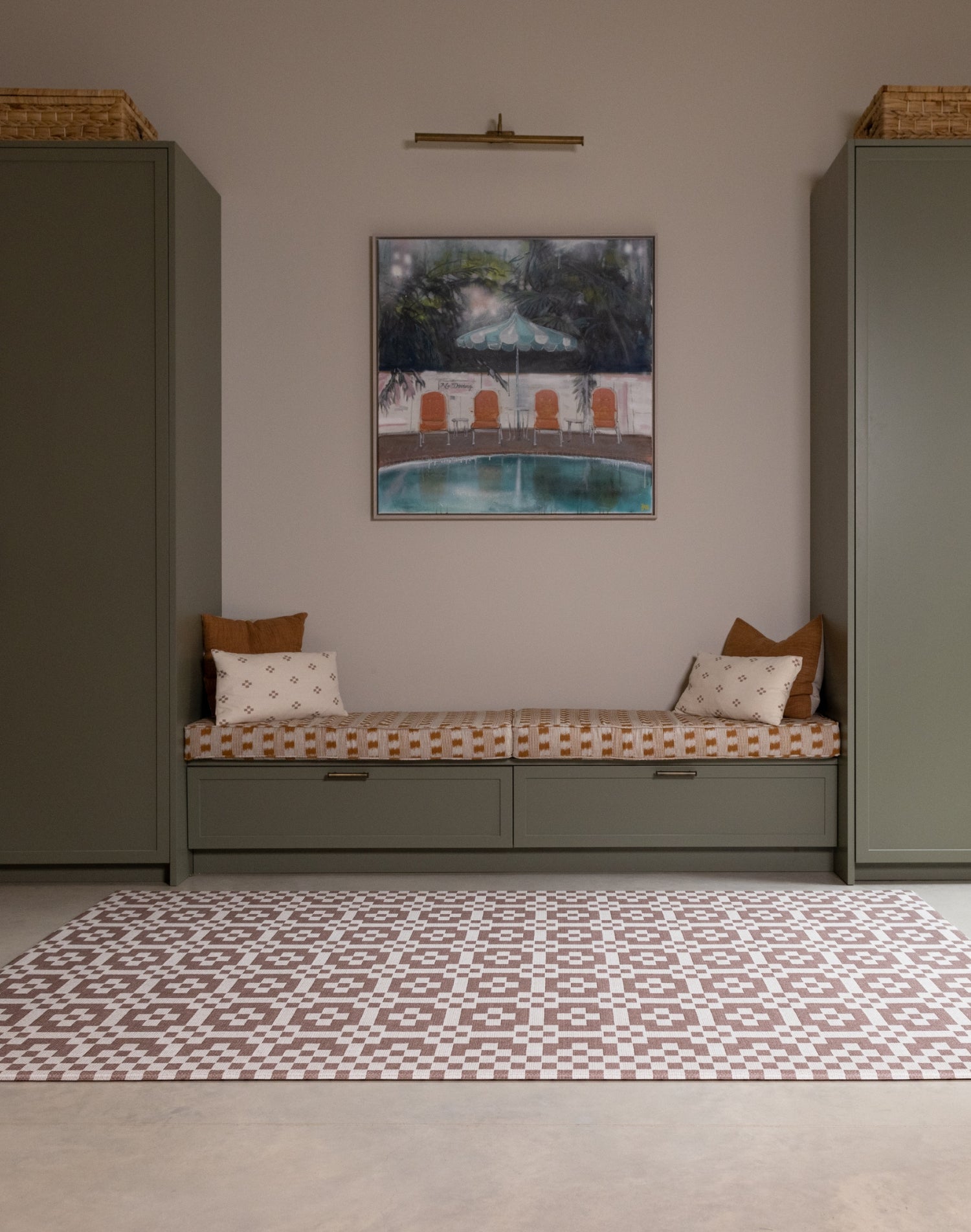 Room interior with the Totter + Tumble Weaver crawling mat for babies. A heritage-inspired play mat in earthy brown red tones