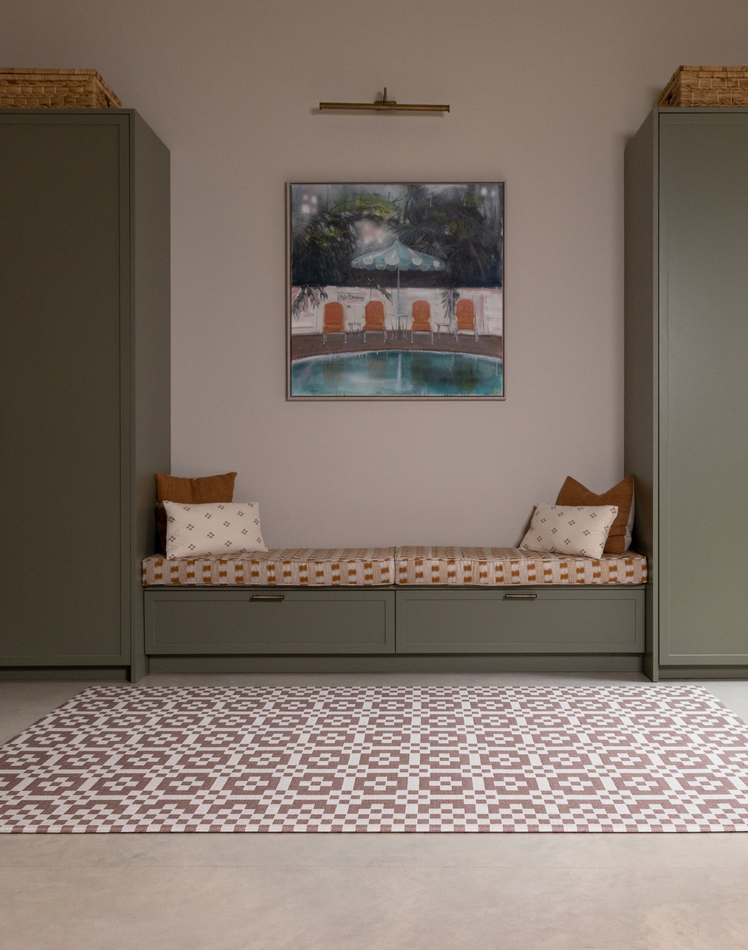 Room interior with the Totter + Tumble Weaver crawling mat for babies. A heritage-inspired play mat in earthy brown red tones