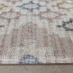 Close-up of a textured non slip Totter and Tumble playmat with geometric pattern on a neutral background