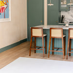 The beachcomber coastal inspired shell design playmat from totter and tumble shown in a kitchen dining room