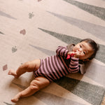 The Counter, Totter + Tumble reversible memory foam playmat with baby