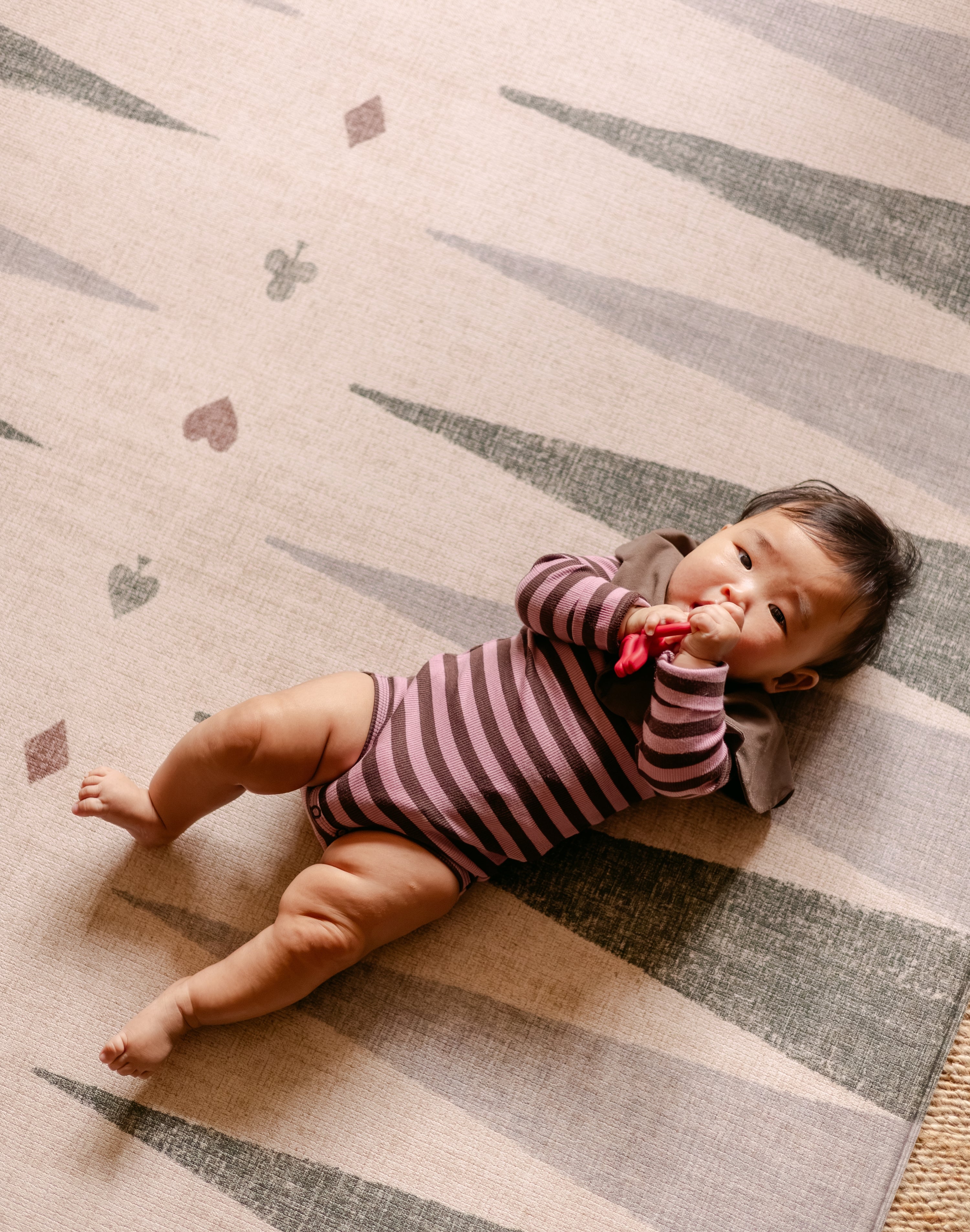The Counter, Totter + Tumble reversible memory foam playmat with baby