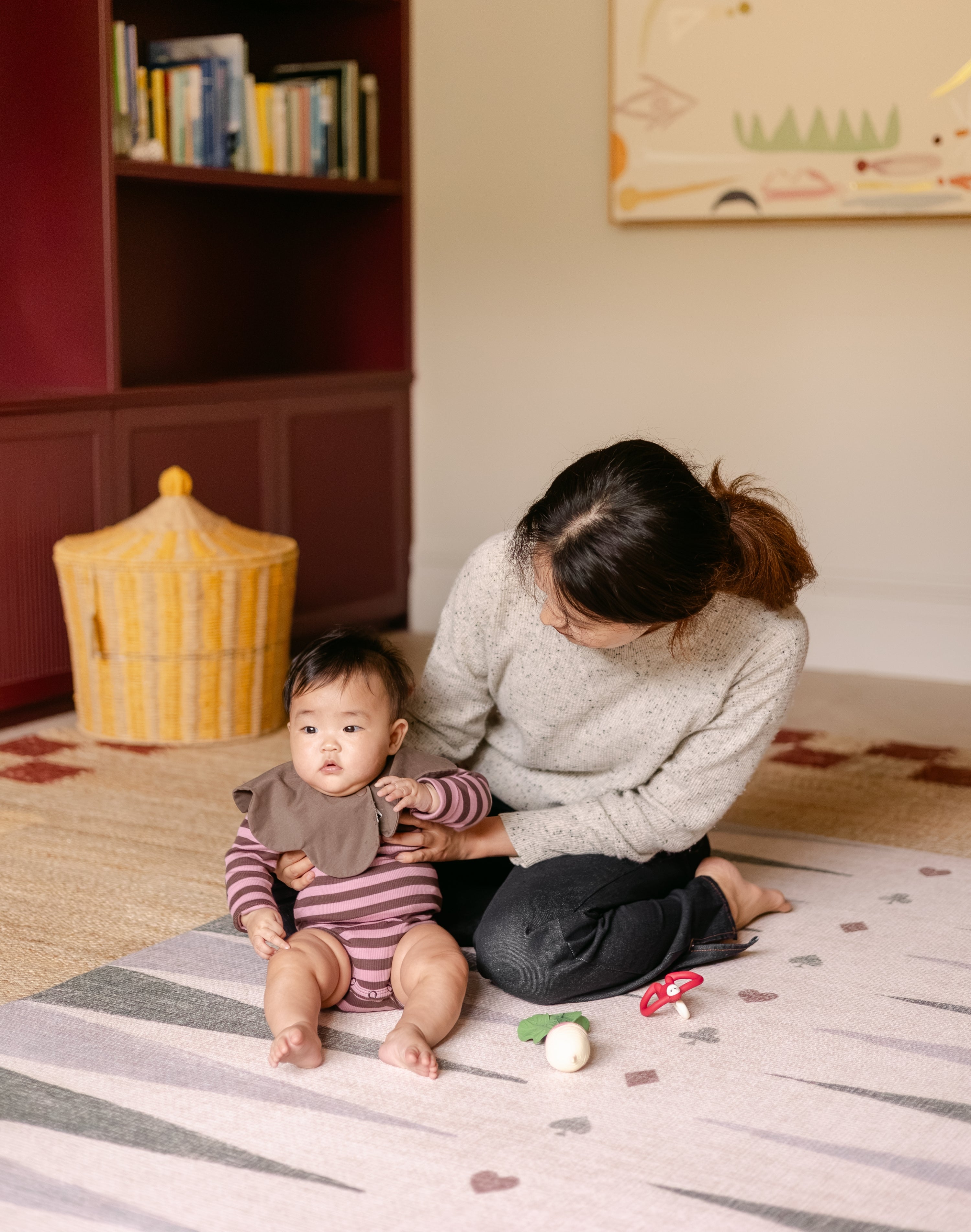 Mum and baby on The Counter, Totter + Tumble wipeable and reversible memory foam playmat