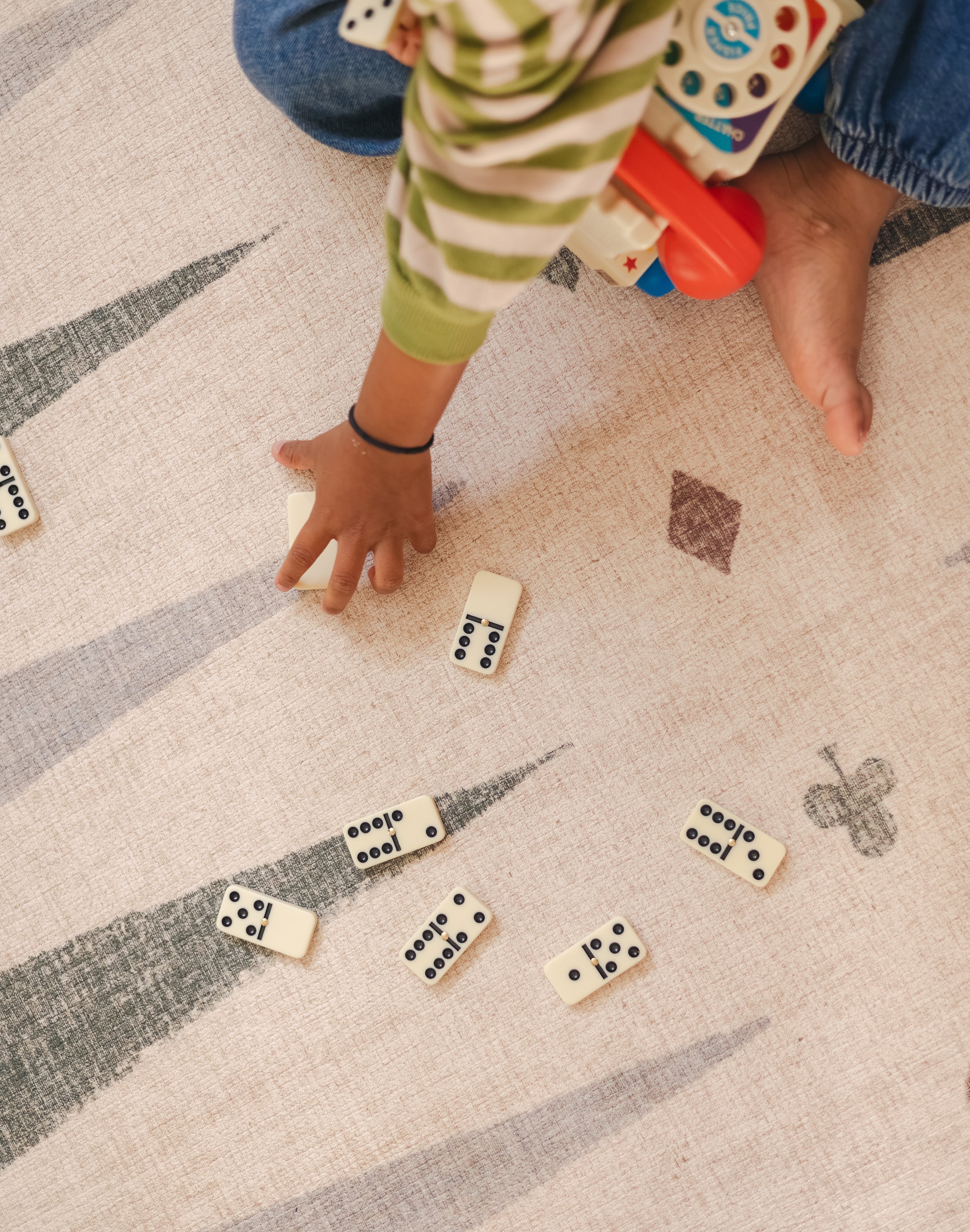 Dominoes on The Counter, Totter + Tumble wipeable and reversible memory foam playmat