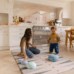 Mum and toddler playing balancing on The Counter, Totter + Tumble wipeable and reversible memory foam playmat