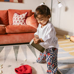 Baby playing on The Counter, Totter + Tumble wipeable and reversible memory foam playmat