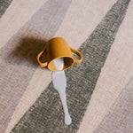 Milk spill on The Counter, Totter + Tumble wipeable and reversible memory foam playmat
