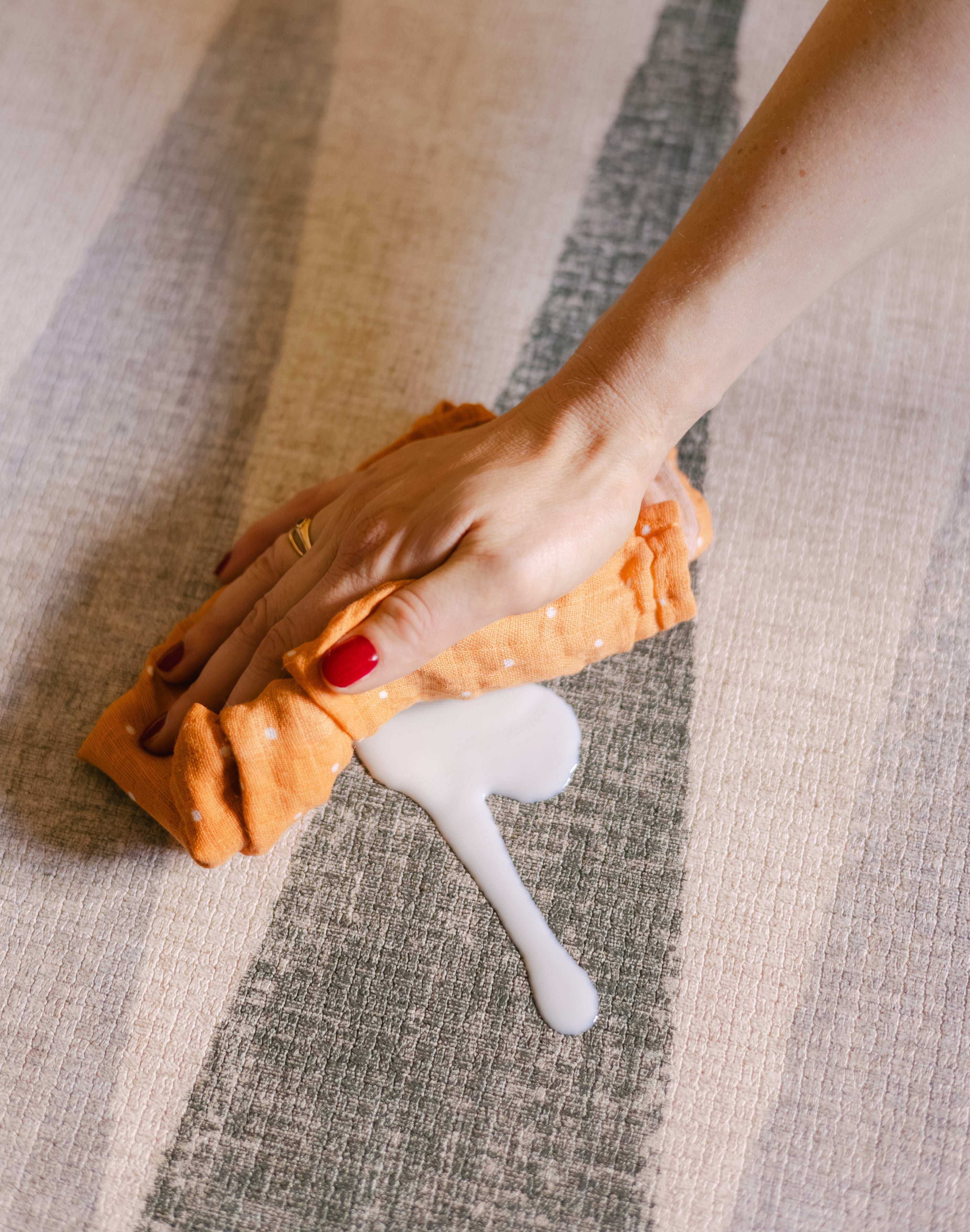 Wipe spillage on The Counter, Totter + Tumble wipeable and reversible memory foam playmat