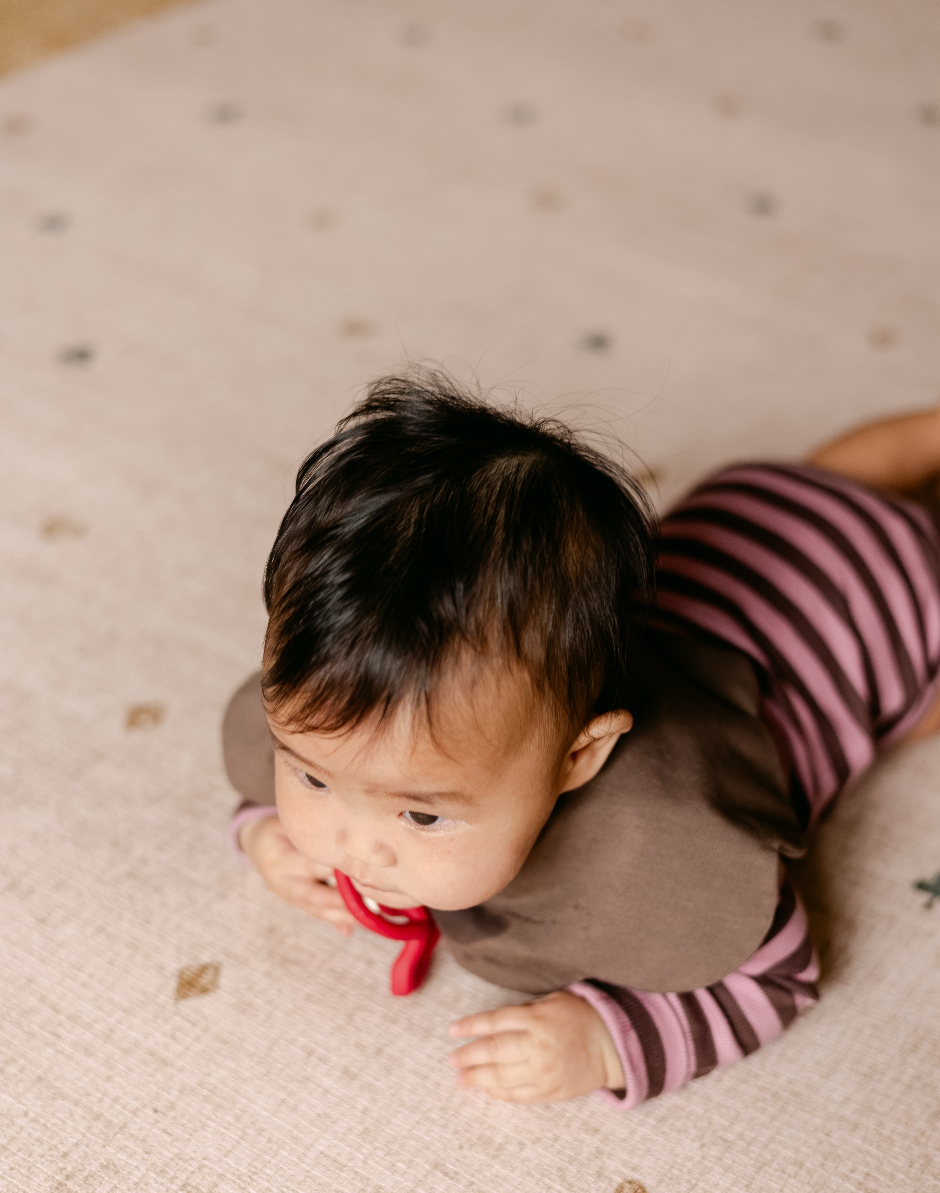 Tummy time on The Wildcard Totter + Tumble reversible wipeable memory foam playmat
