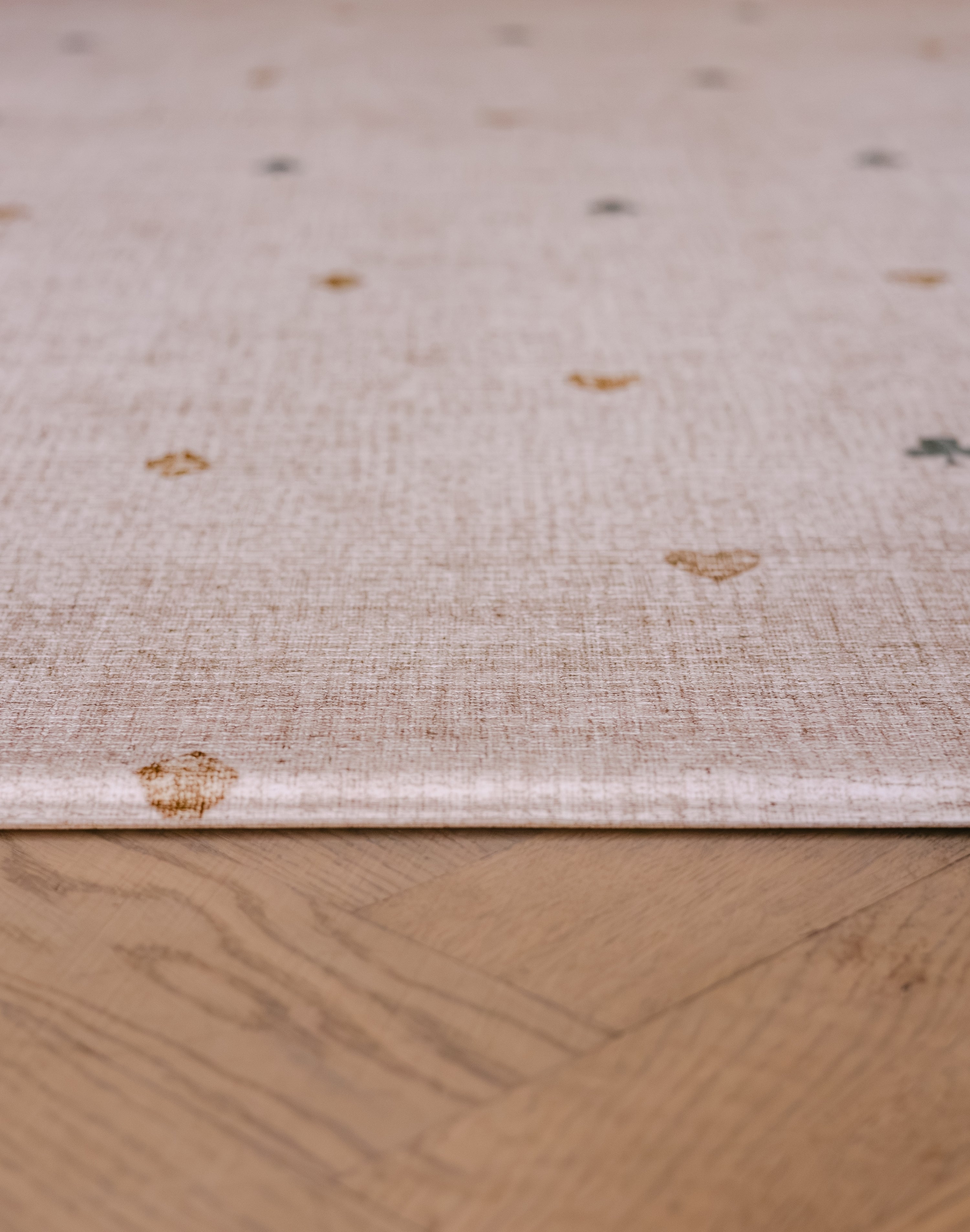 The edge of The Wildcard Totter + Tumble reversible wipeable memory foam playmat