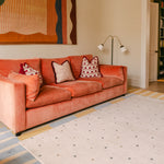The Wildcard Totter + Tumble reversible wipeable memory foam playmat in a bright stylish living room
