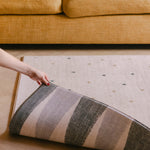Fold back of the two sides of The Wildcard Totter + Tumble reversible wipeable memory foam playmat