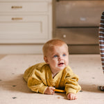 Happy tummy time on The Wildcard Totter + Tumble reversible wipeable memory foam playmat