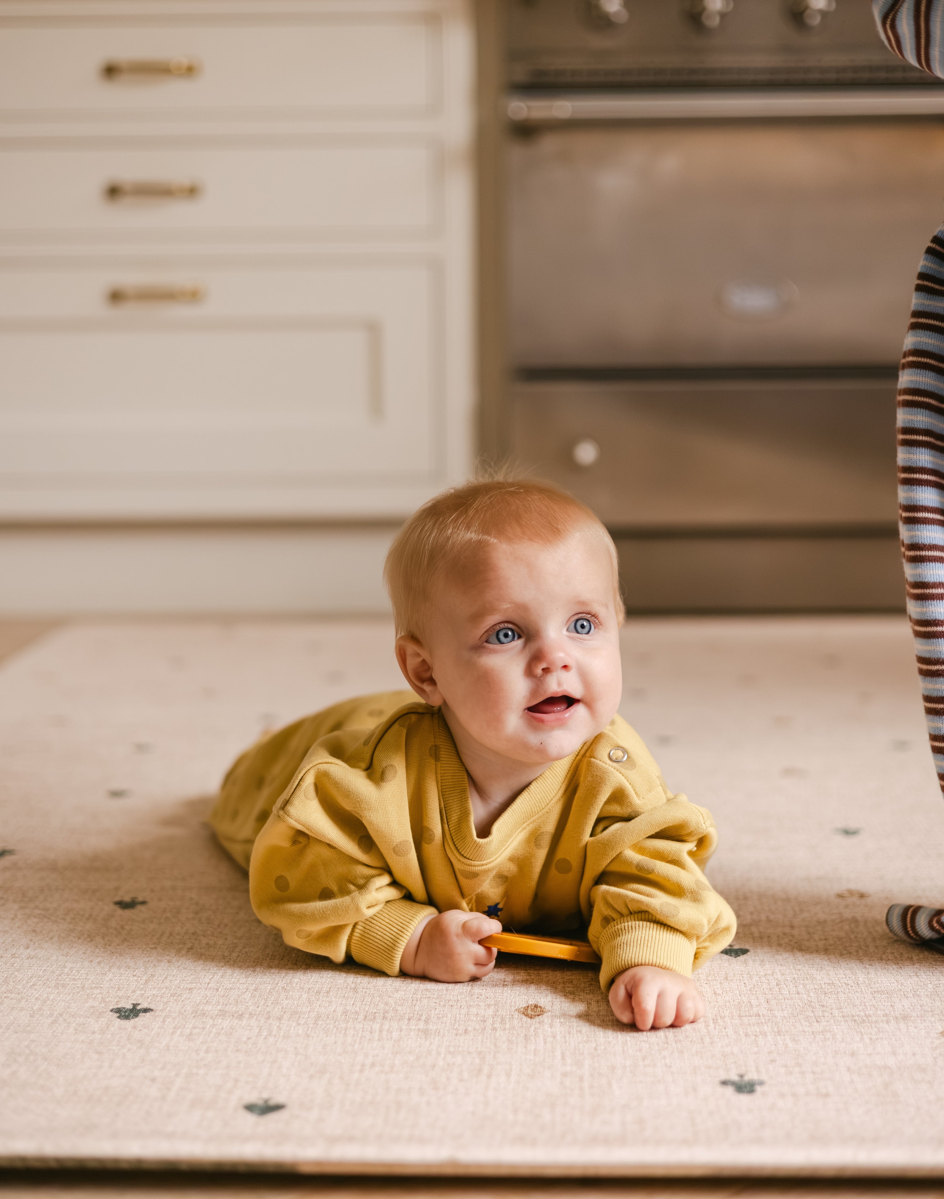Happy tummy time on The Wildcard Totter + Tumble reversible wipeable memory foam playmat
