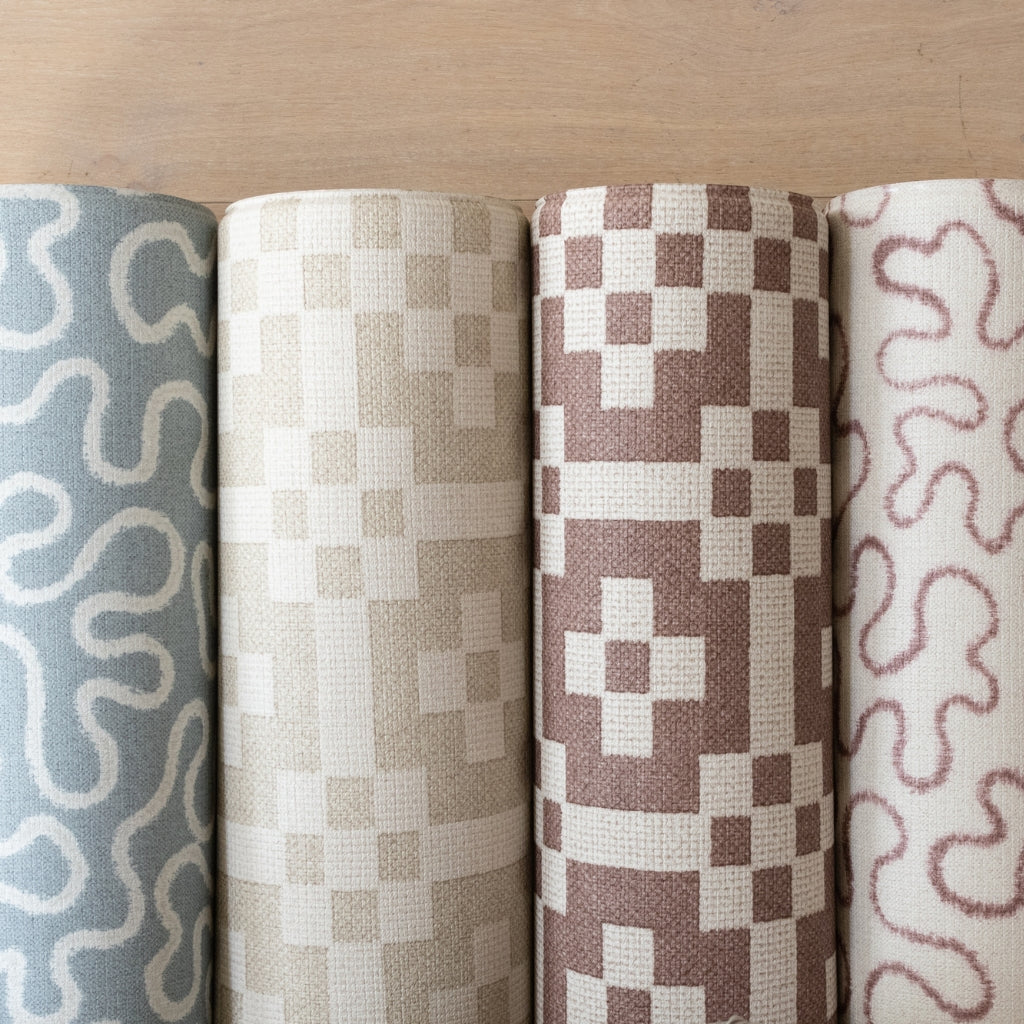 The Woven + Wild collection by Totter + Tumble. Rolled playmats in woven textures and flowing abstract patterns